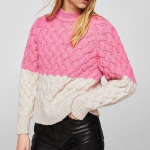 Bicolor cable-knit sweater